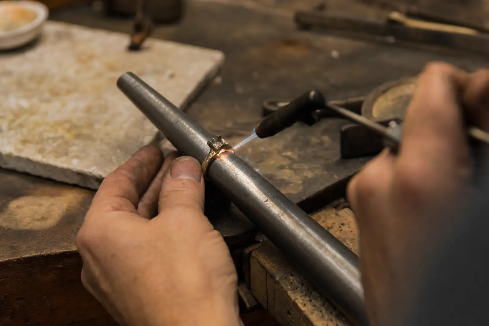 An old ring shank being rebuilt on a mandrel at the bench