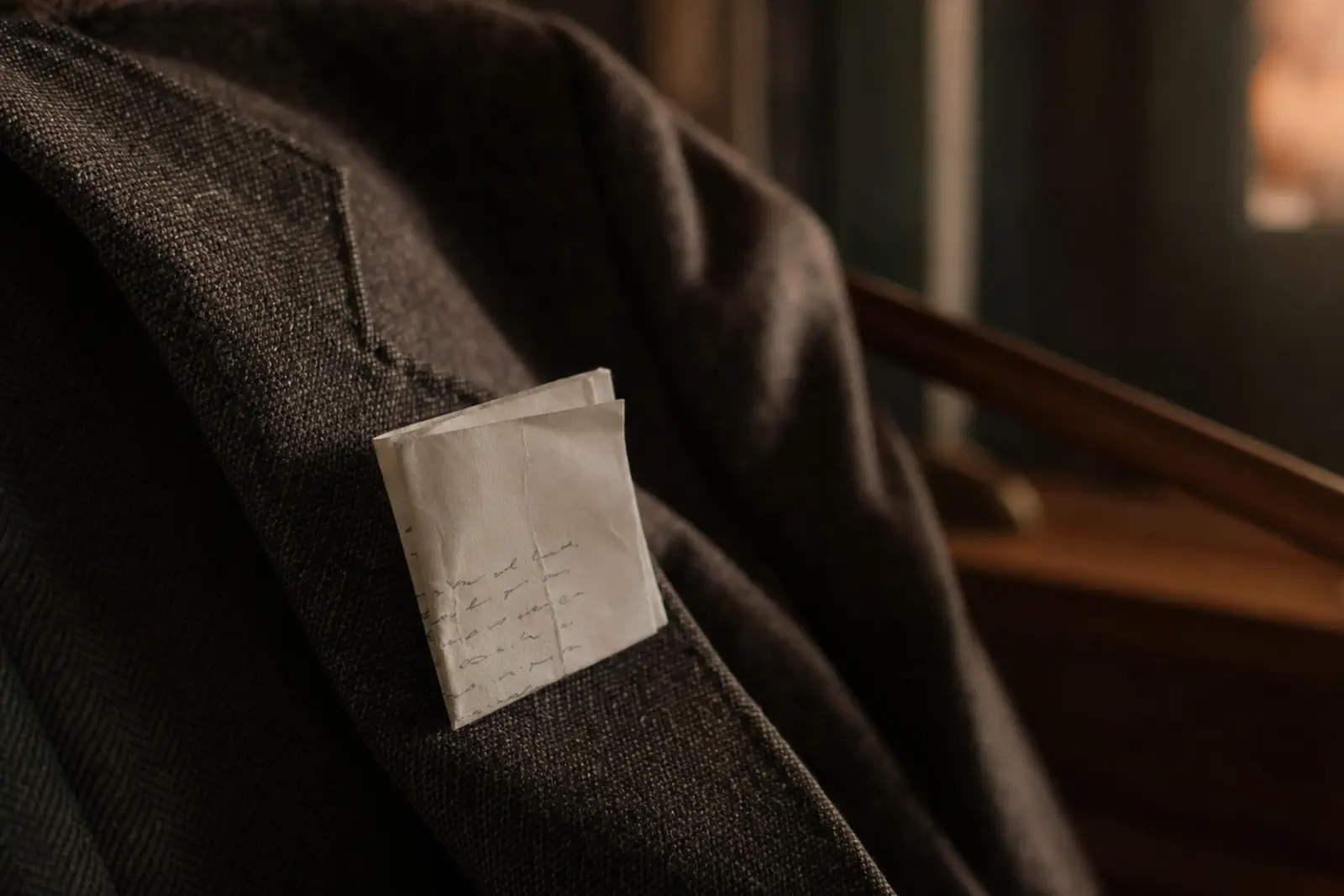 A short handwritten note folded small enough to fit in a jacket pocket