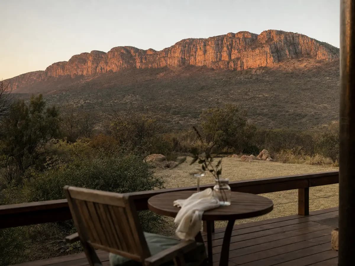 A quiet terrace facing the Magaliesberg escarpment at dusk