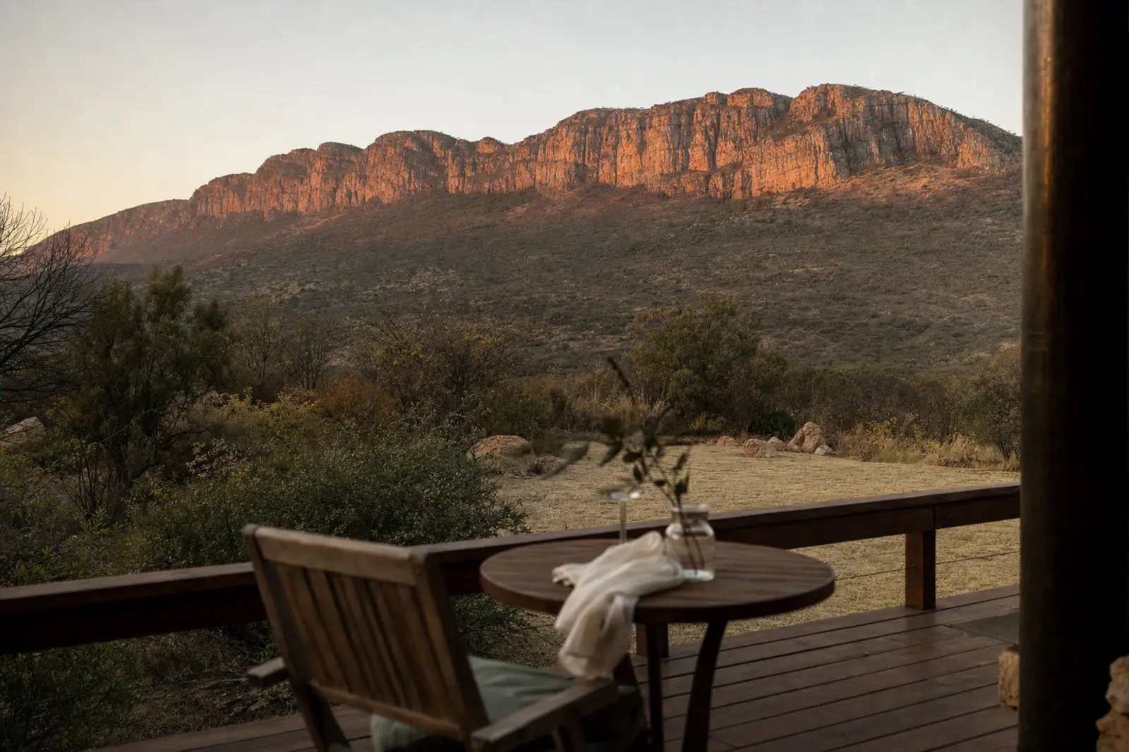 A quiet terrace facing the Magaliesberg escarpment at dusk