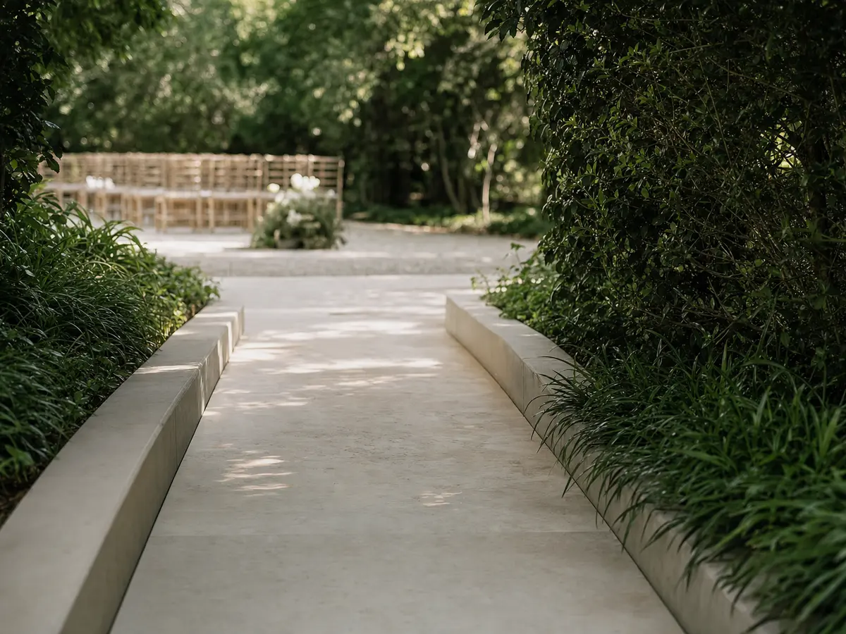 A smooth level pathway with a gentle ramp leading toward a garden wedding ceremony area