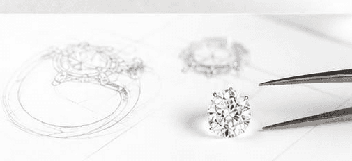 An engagement ring sketch beside a loose diamond